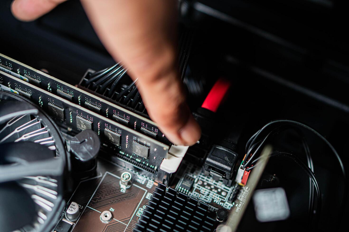 Installing RAM on a computer motherboard photo