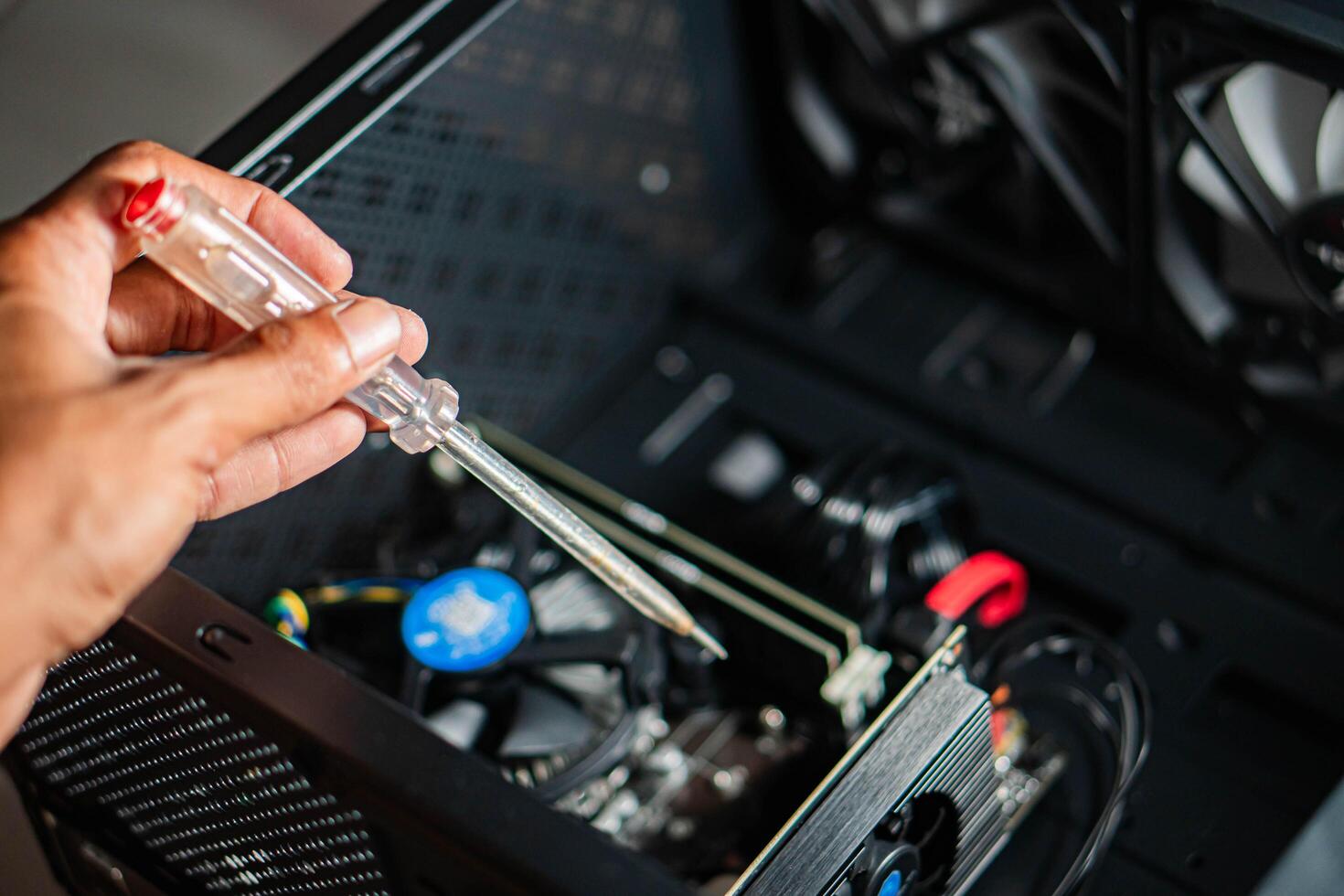 Assembling or repairing a computer with a screwdriver photo