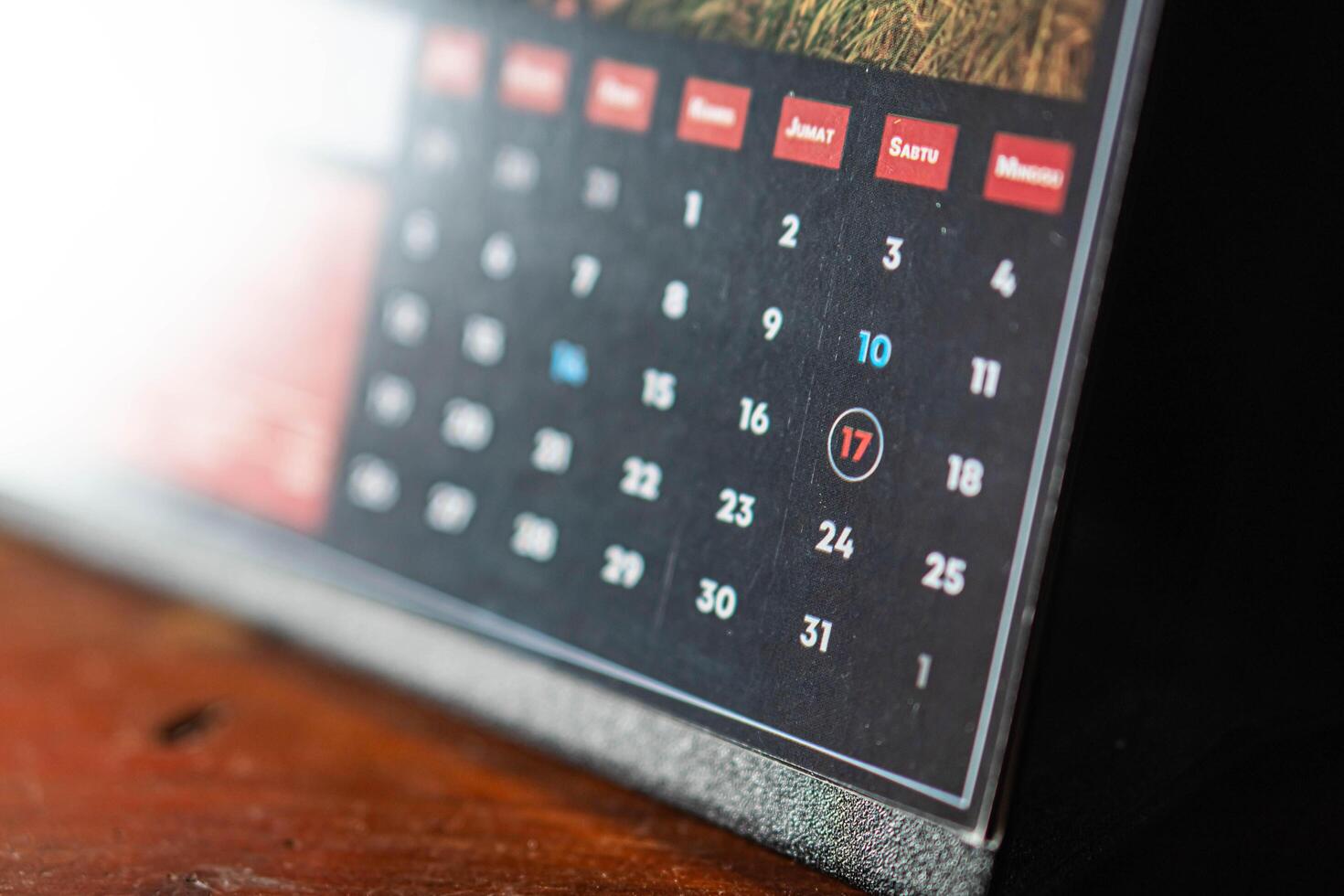 Close-up of desk calendar with circled date photo