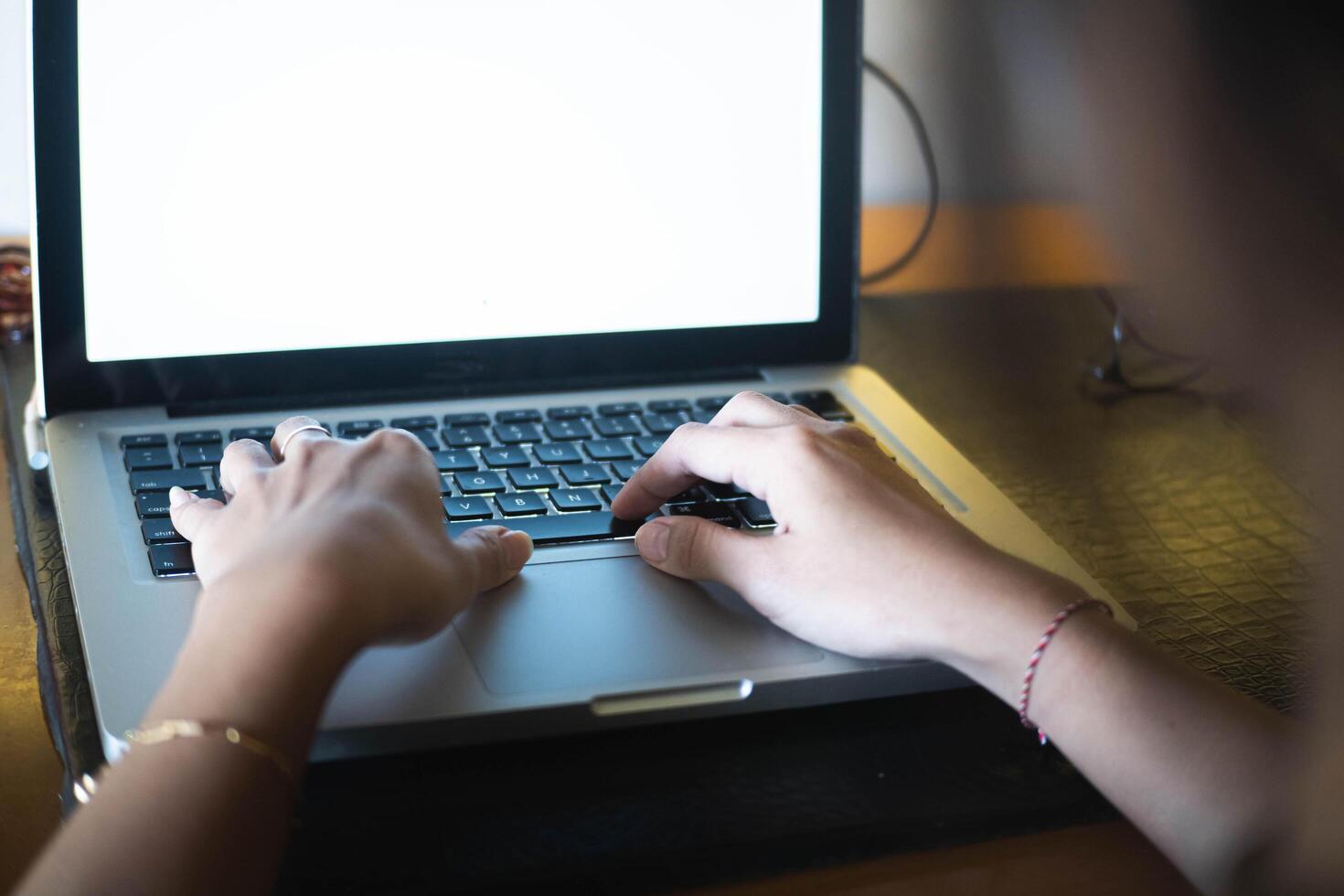 work from home, Over-the-Shoulder View of Laptop Use photo