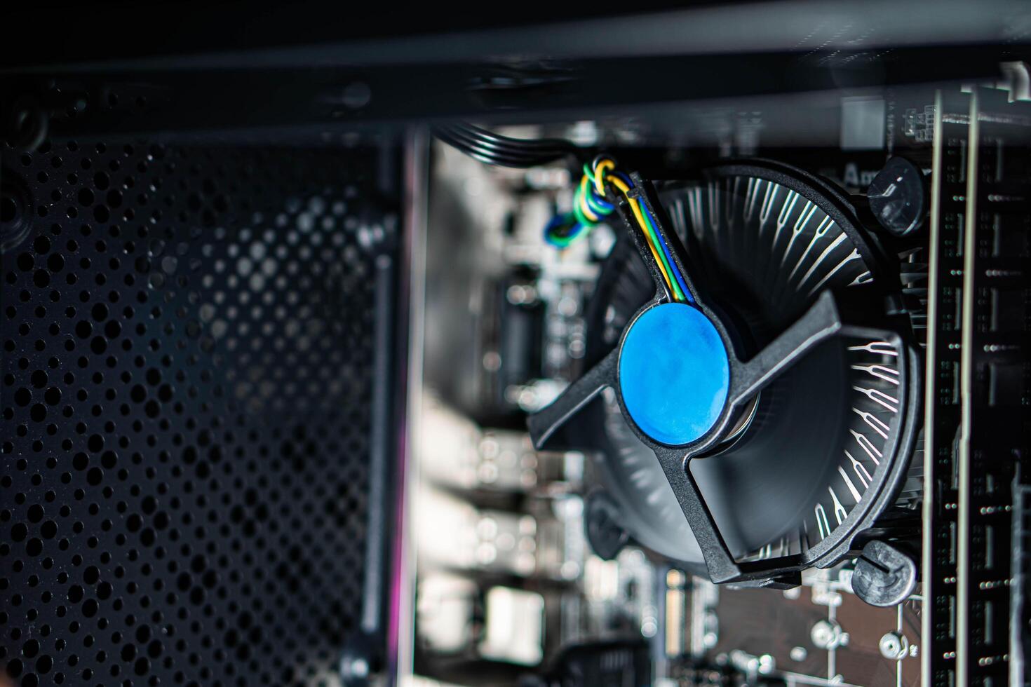 Close-up of computer CPU cooler and internal components photo