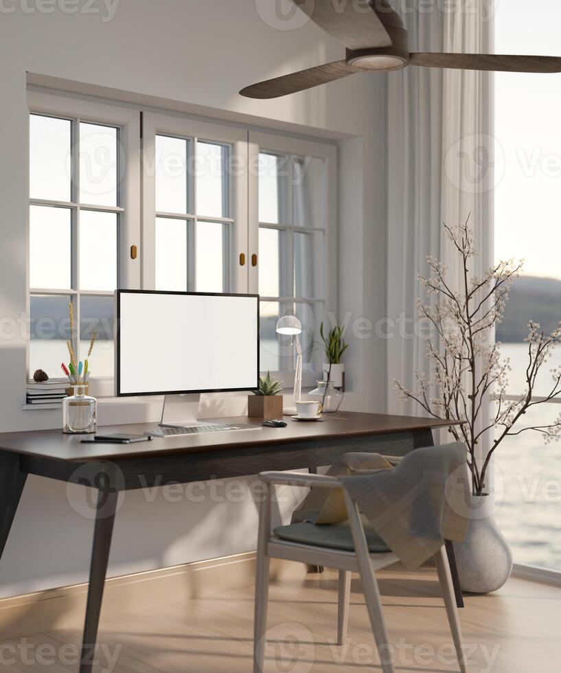A modern home working room with a computer desk near by the window, a ceiling fan, and accessories. photo