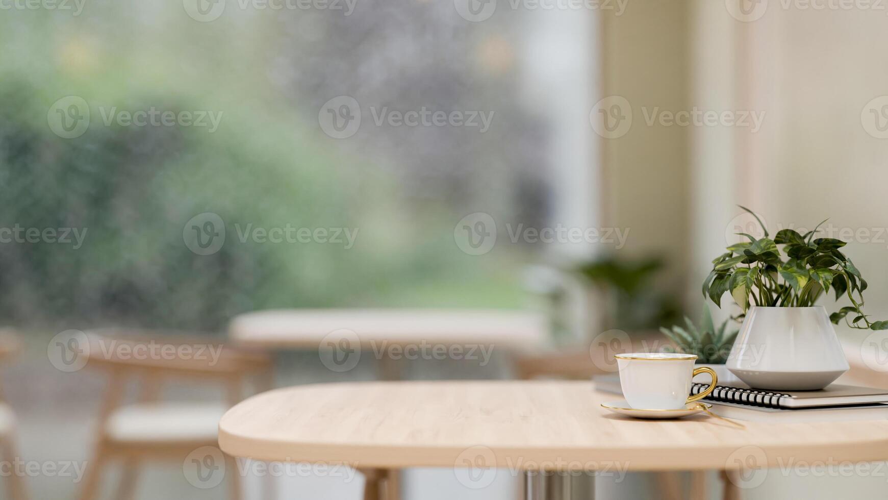 A close-up image of a wooden table in a beautiful, cozy contemporary coffee shop. photo