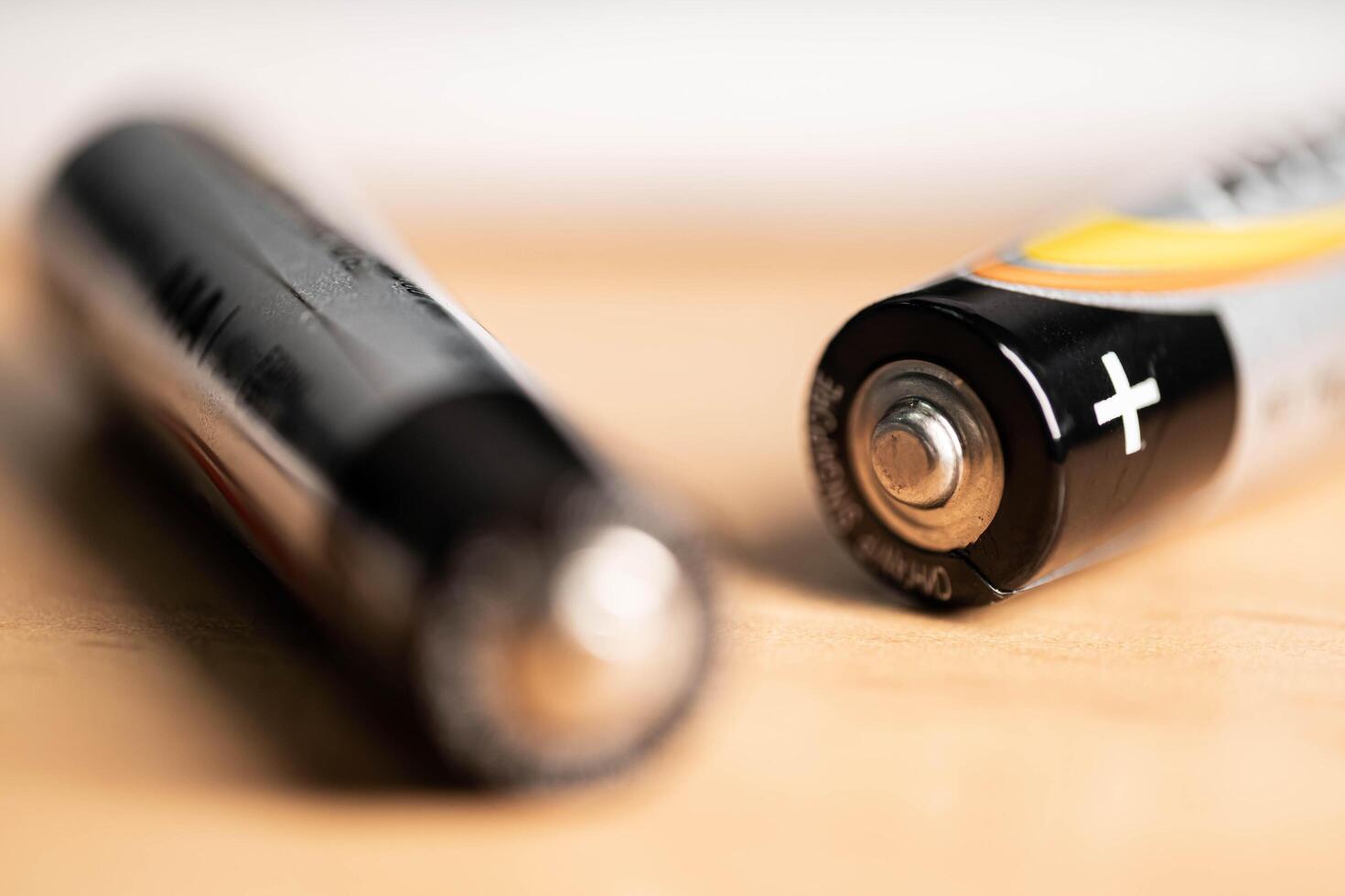 closeup of golden and silver aa alkaline batteries photo