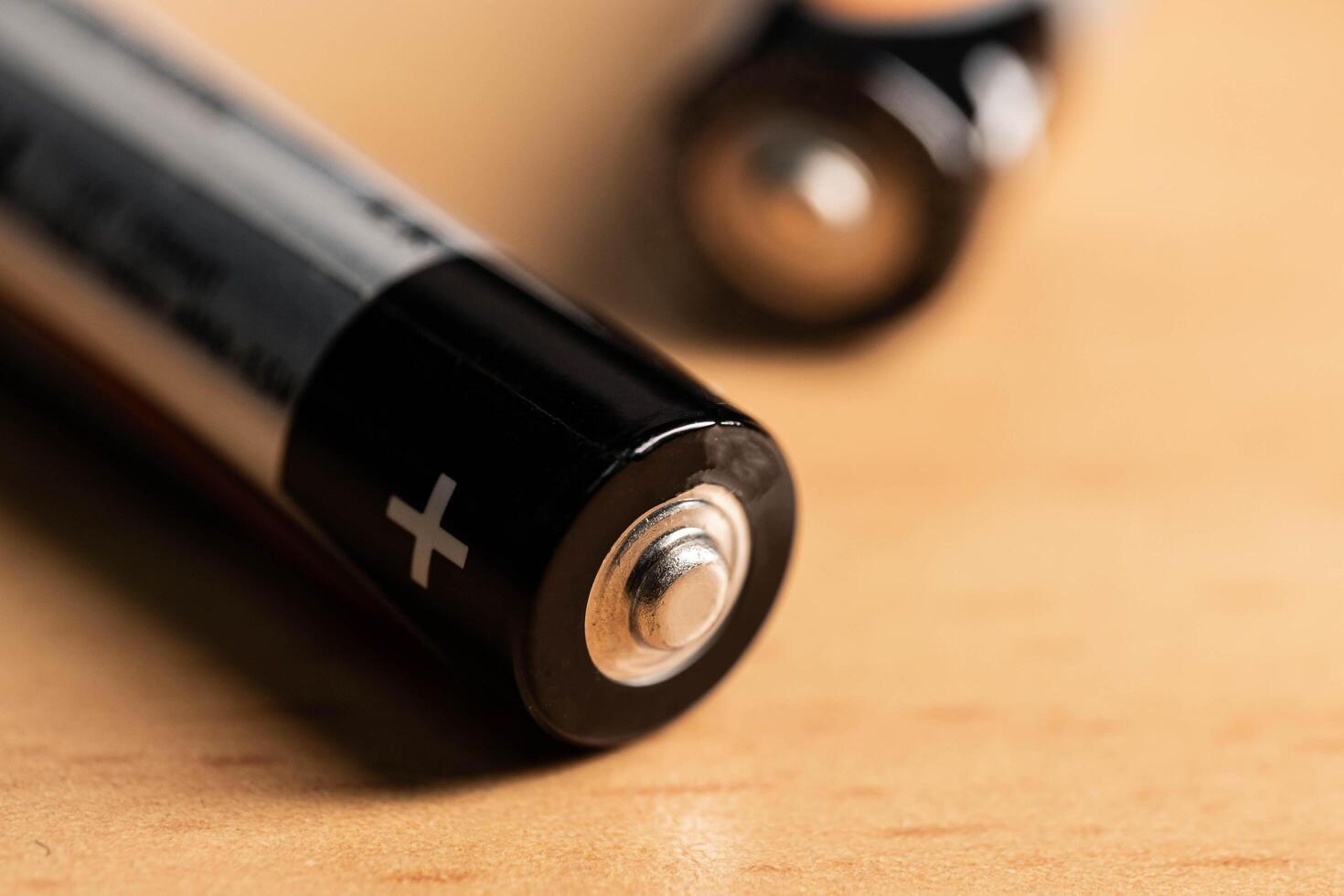 closeup of golden and silver aa alkaline batteries photo