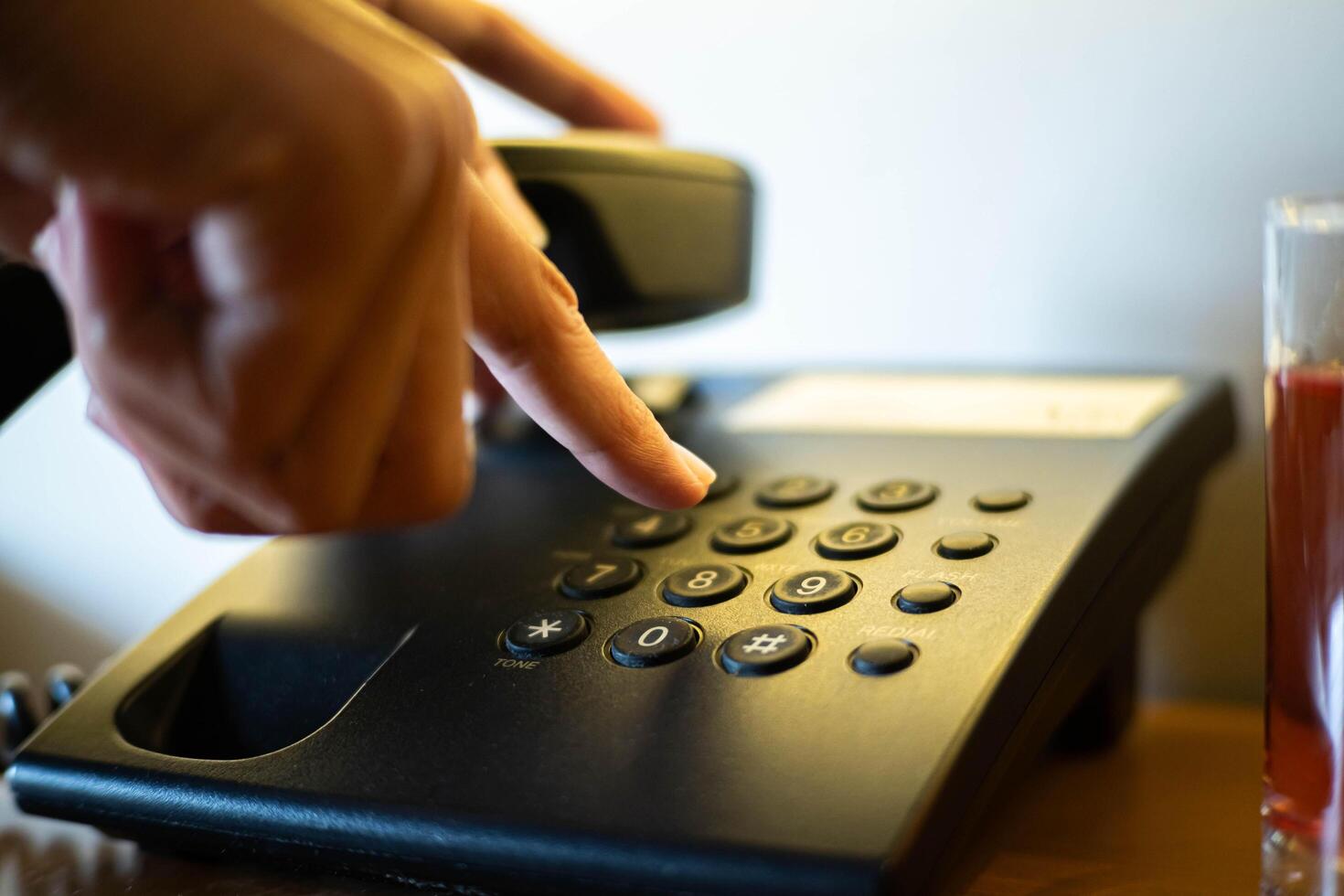 Hand Dialing on Sleek Office Telephone photo