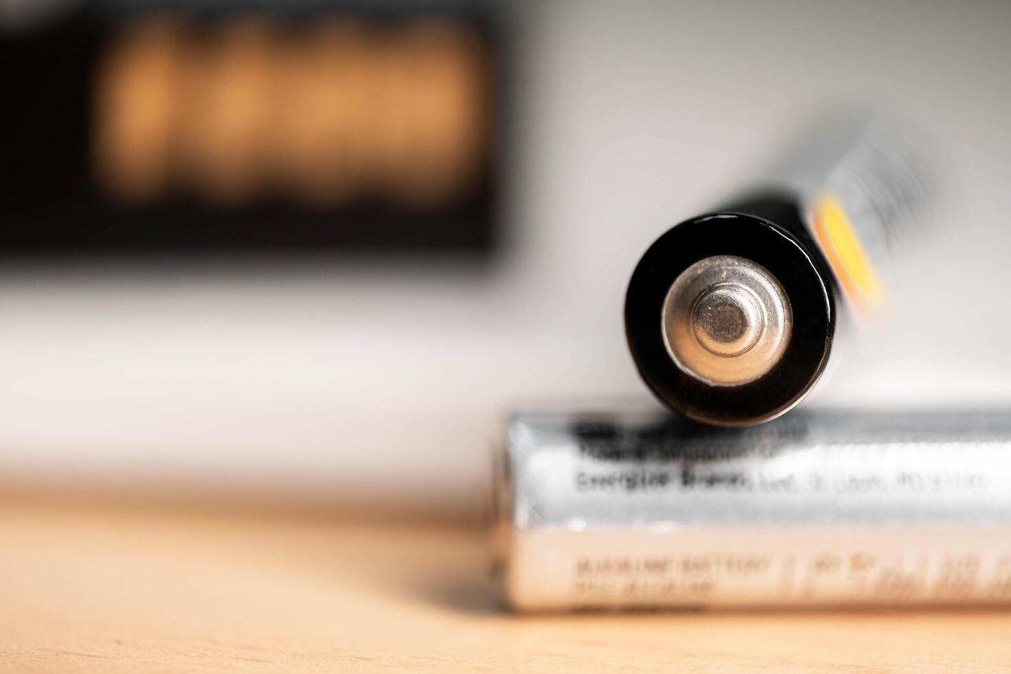 closeup of golden and silver aa alkaline batteries photo