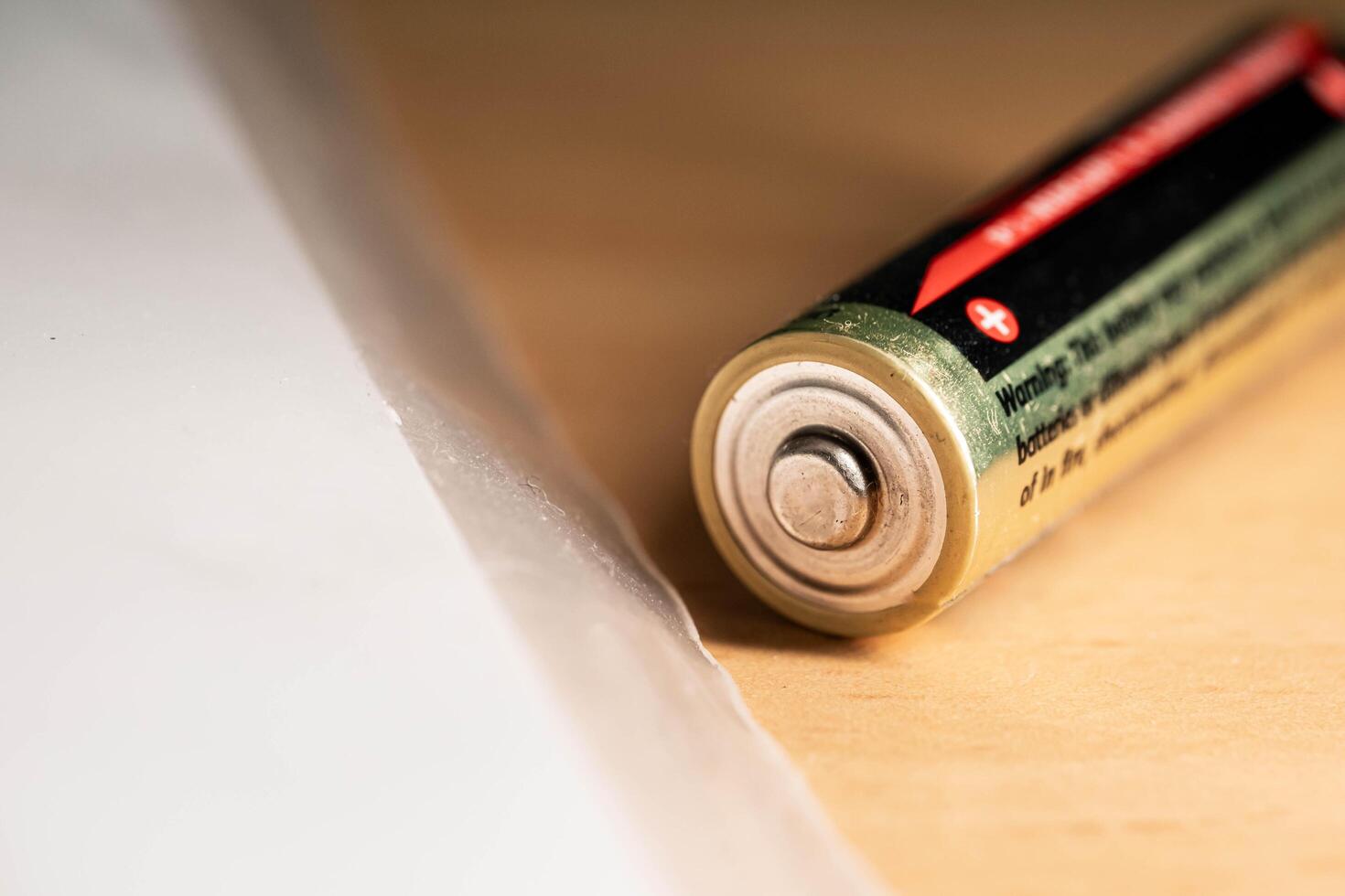 closeup of golden and silver aa alkaline batteries photo