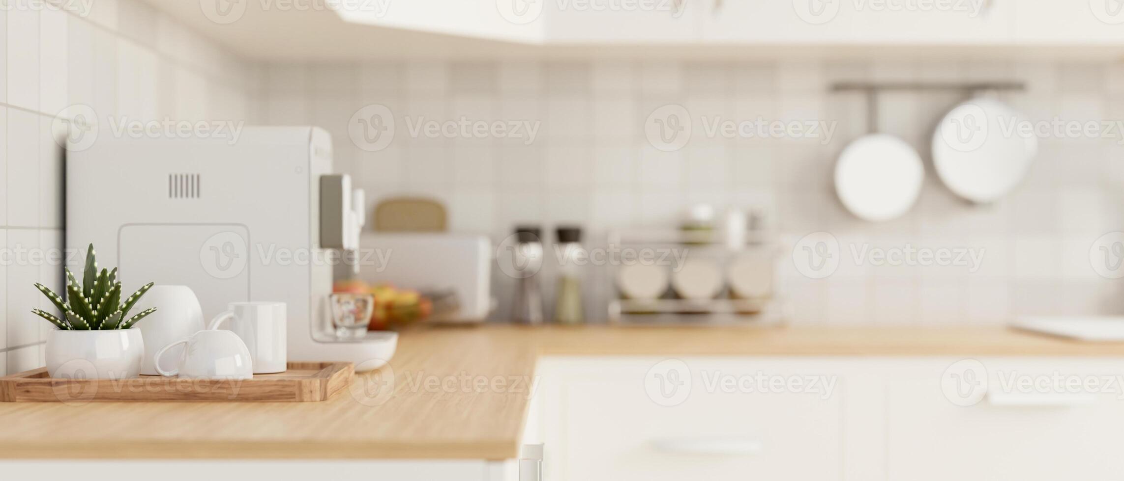 Side view of a kitchen countertop with kitchen appliances in a modern white kitchen. photo