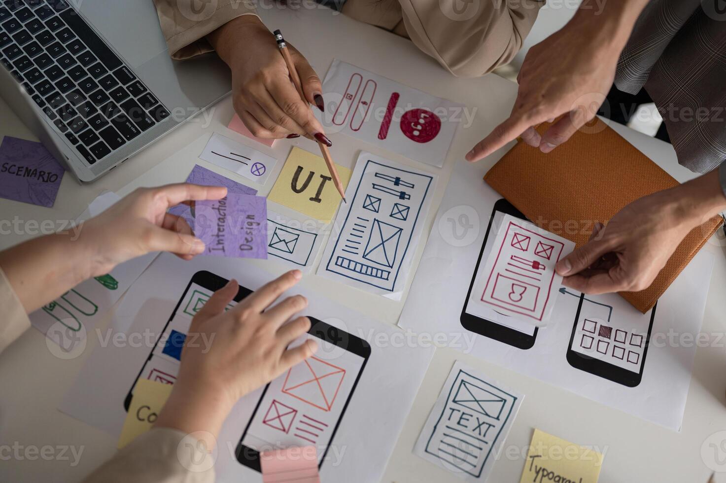 Top view image of a UX UI graphic designer team voting a perfect prototype in the meeting. photo