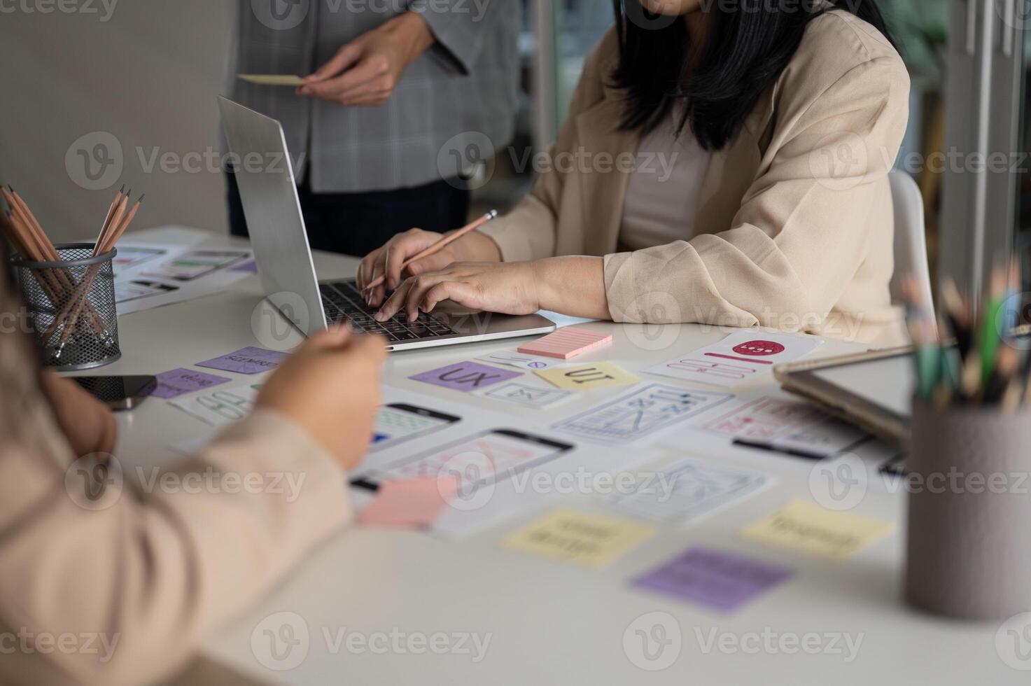 Group of graphic designer in the meeting, brainstorming and planning their new project together. photo