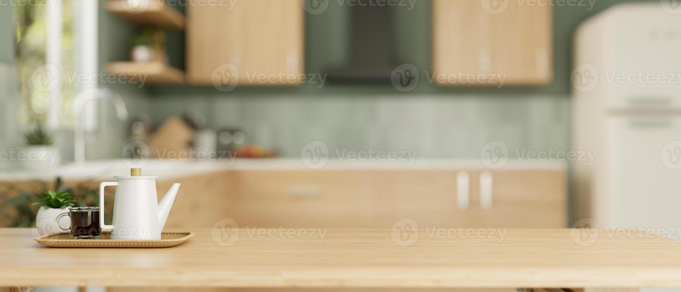 A coffee pot and a coffee cup on a wooden dining table in a modern kitchen. photo