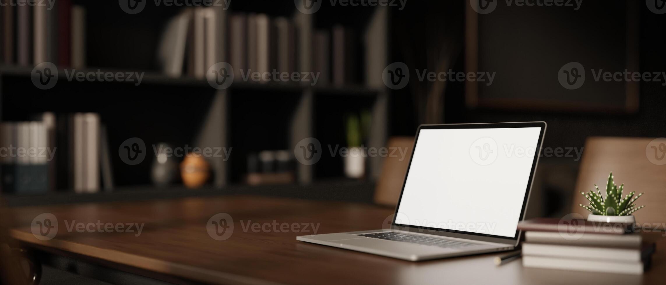 A white-screen laptop computer mockup on a hardwood desk in a modern private office. photo