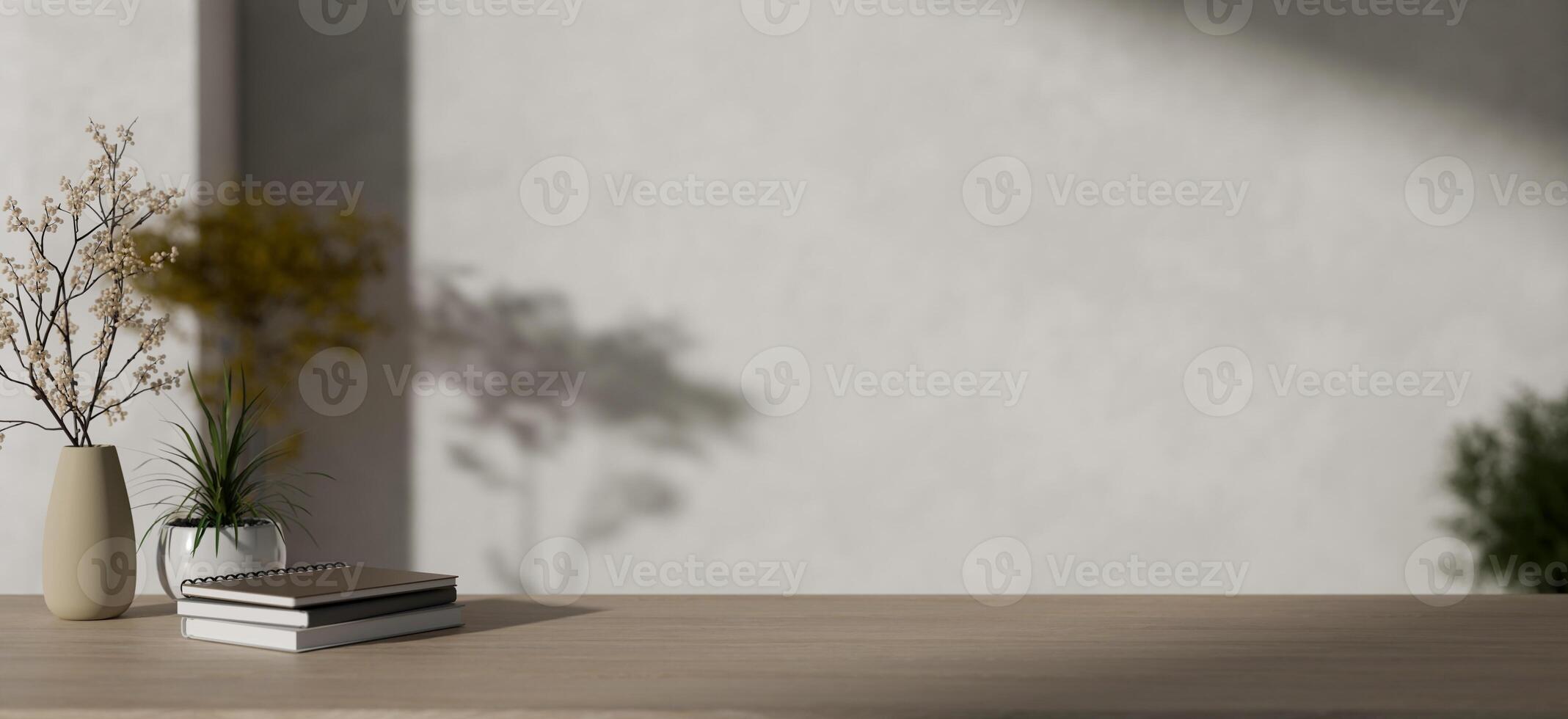 Books, flower vases, and a copy space on a minimalist wooden table against a minimalist white wall. photo