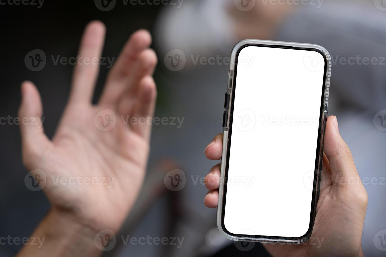 Close-up image of a dissatisfied man using his phone, unhappy with a lack mobile application. photo