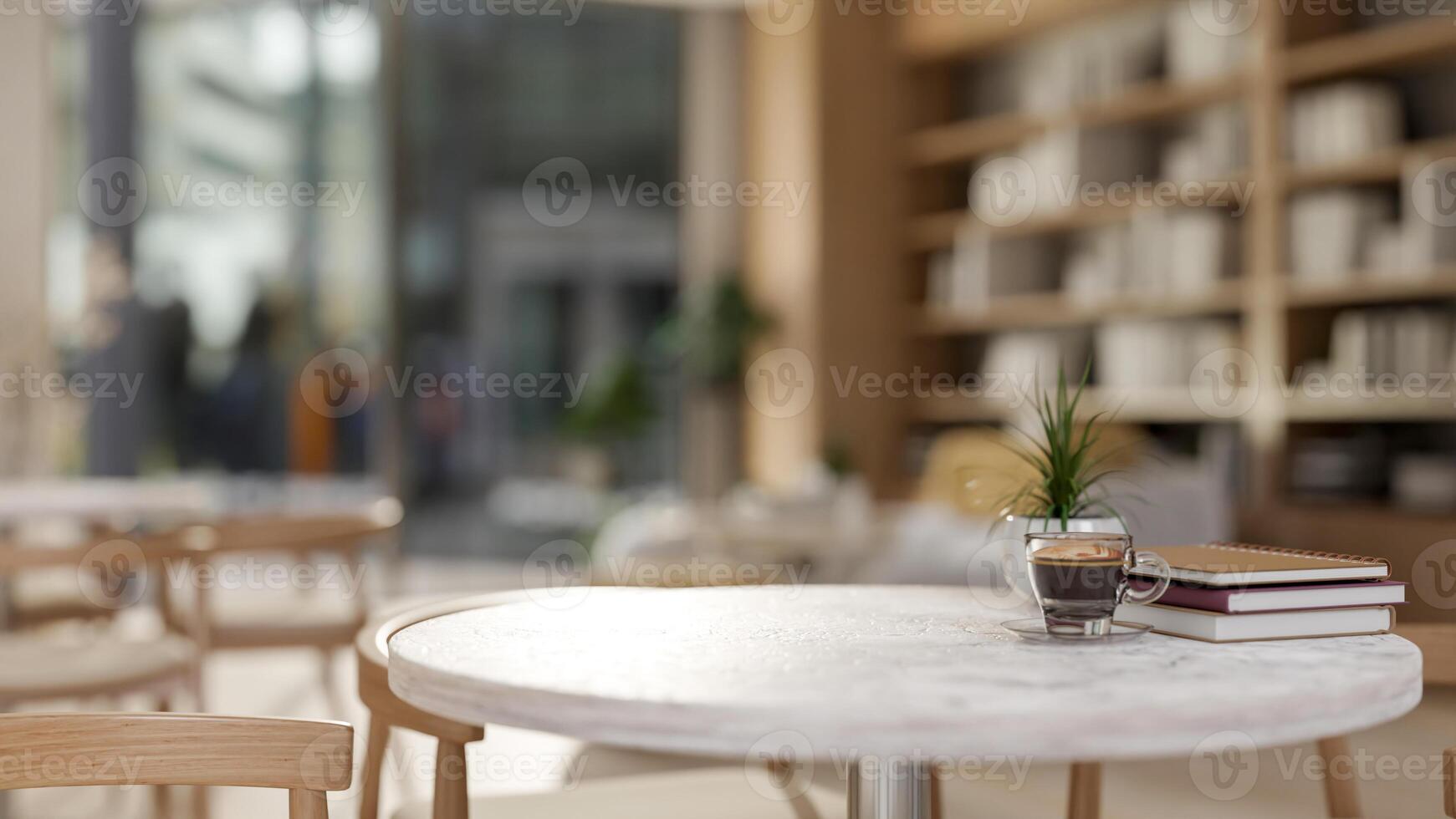 A neutral round marble table with wooden armchairs in a cozy contemporary coffee shop or library photo