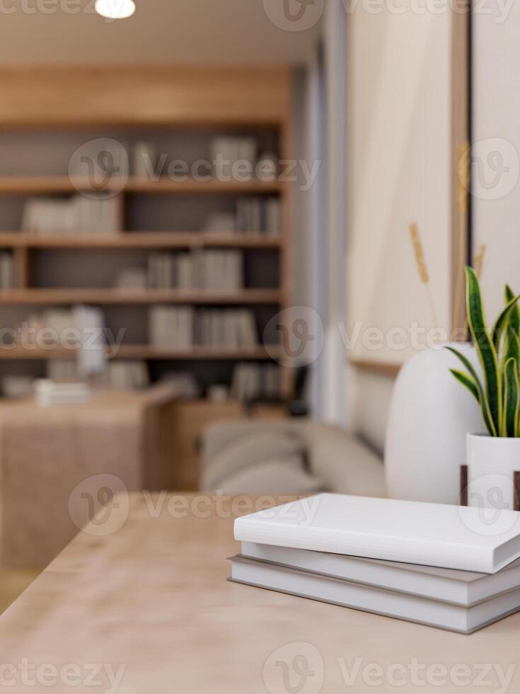 A stack of books and decorative plants are on a table in a modern contemporary living room. photo