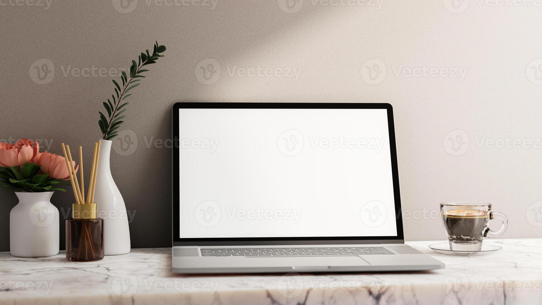 A laptop computer white-screen mockup on a white marble table against the white wall. photo