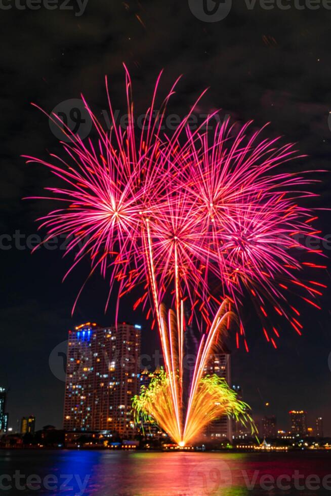 fireworks on the river in the dark sky photo
