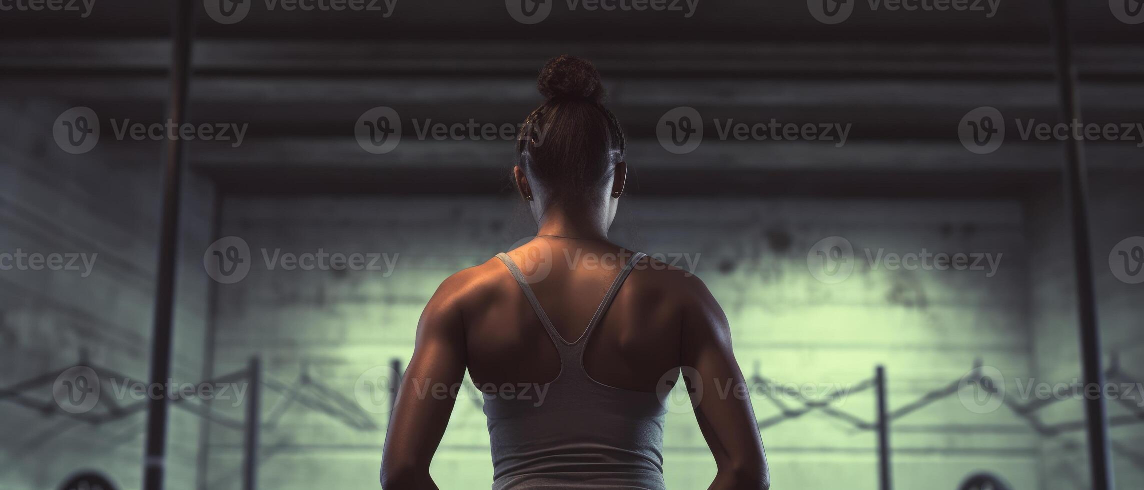 African american woman working out in gym on gym background, copy space for text or design. . photo