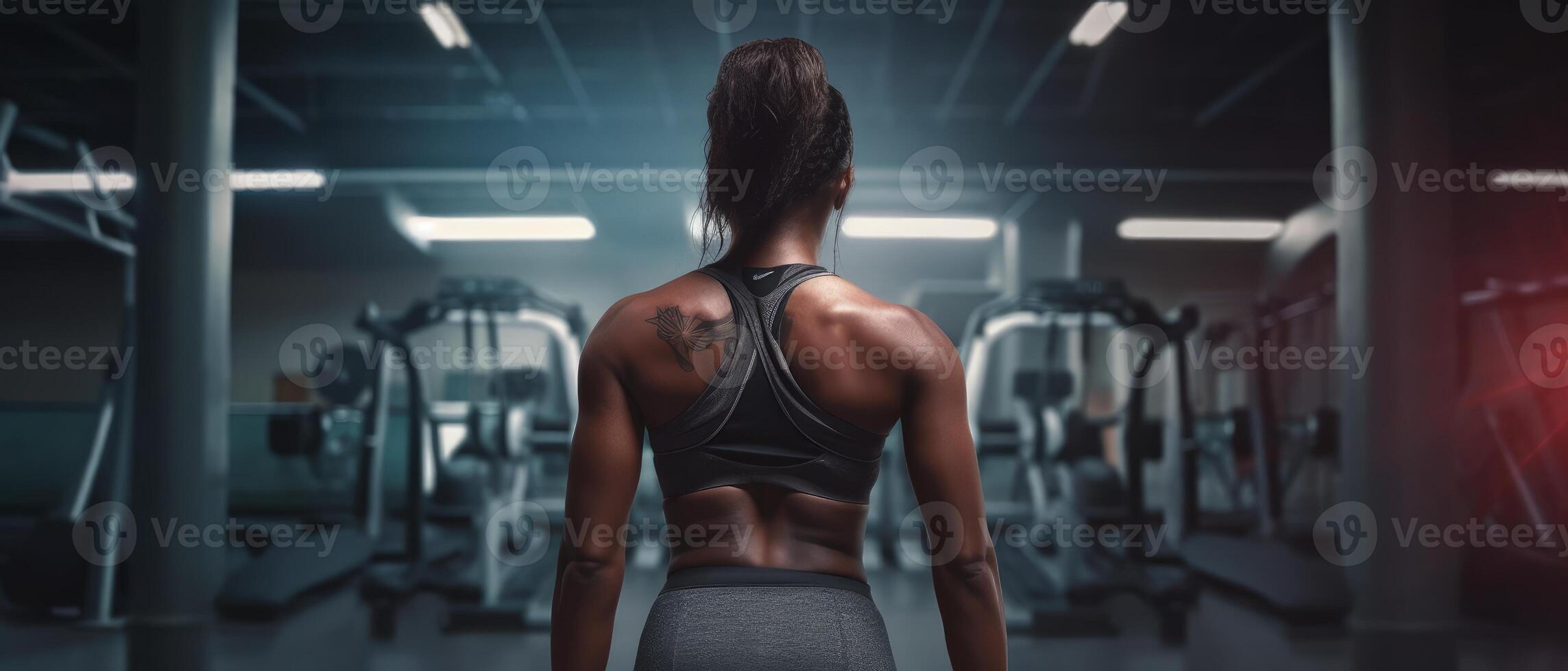 African american woman working out in gym on gym background, copy space for text or design. . photo
