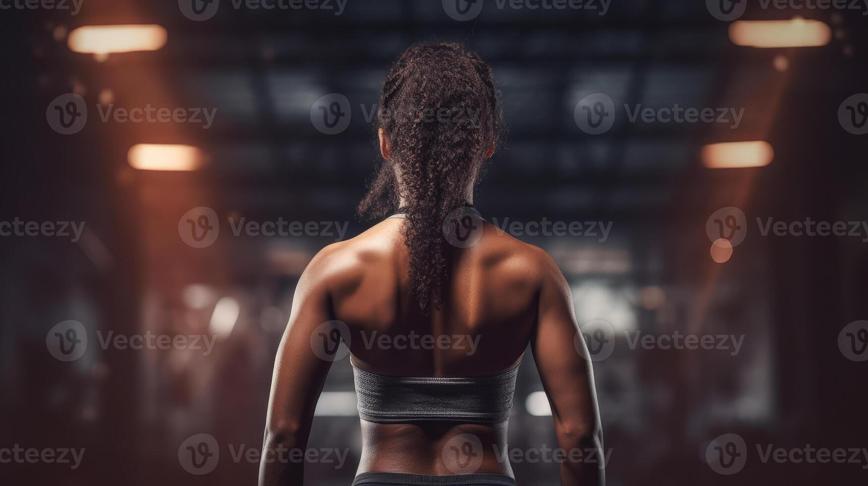 African american woman working out in gym on gym background, copy space for text or design. . photo