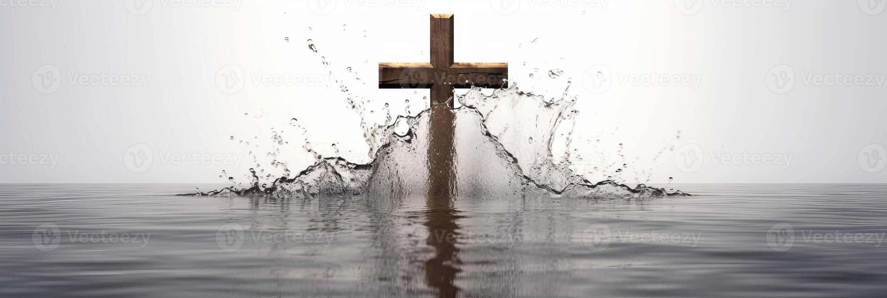 Wooden cross stands surrounded by water. . photo