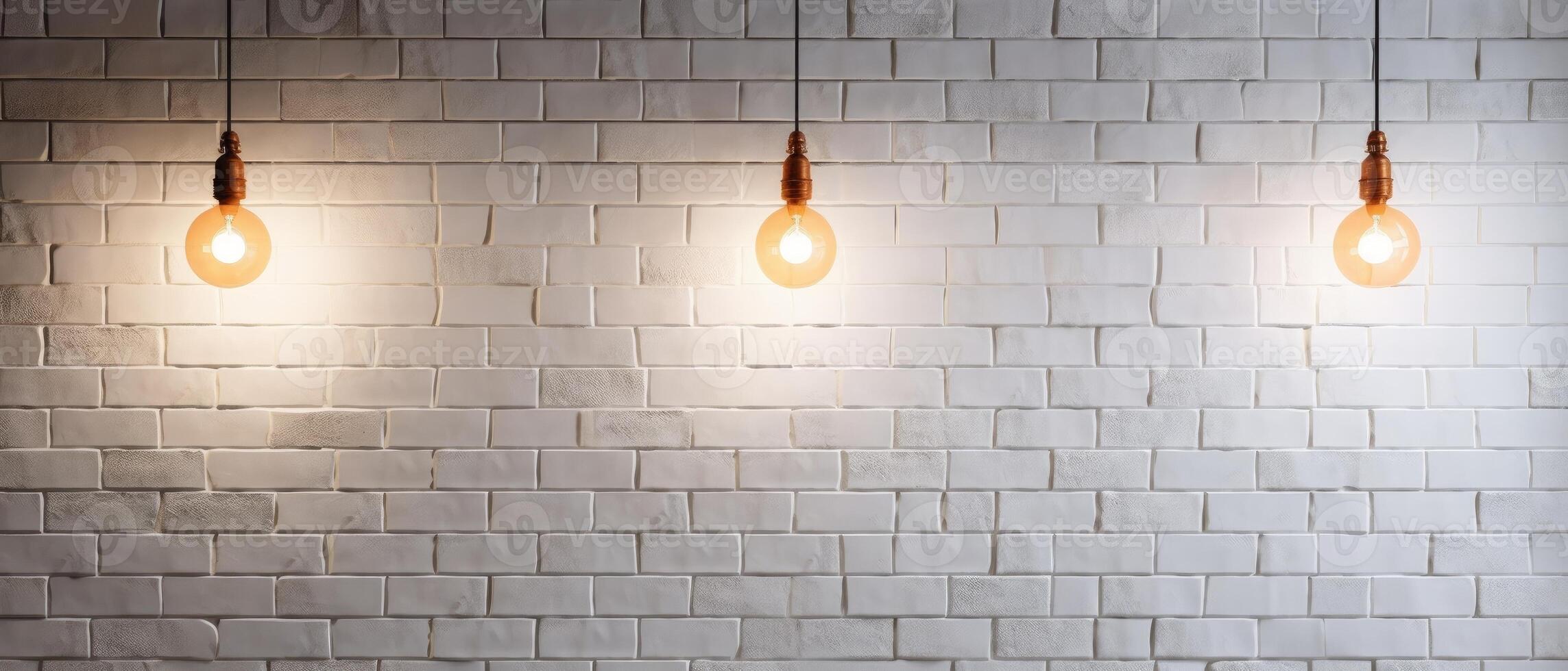 White brick wall with a lamp on the background of stone tiles. . photo