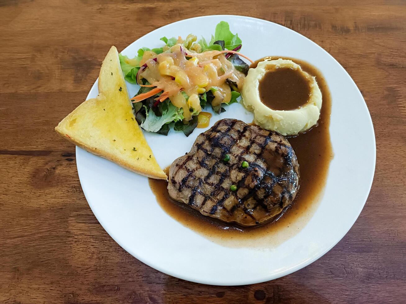 black pepper steak on table photo