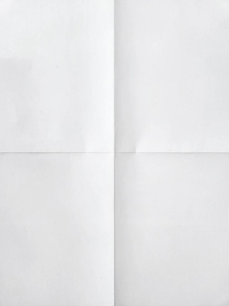 white sheet of paper folded in four photo