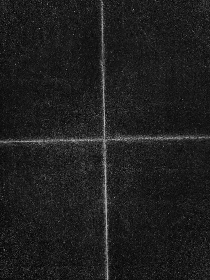 Folded paper with grungy texture in black background. can be used to replicate the aged and worn look for your creative design. old paper for photo texture overlay in retro style