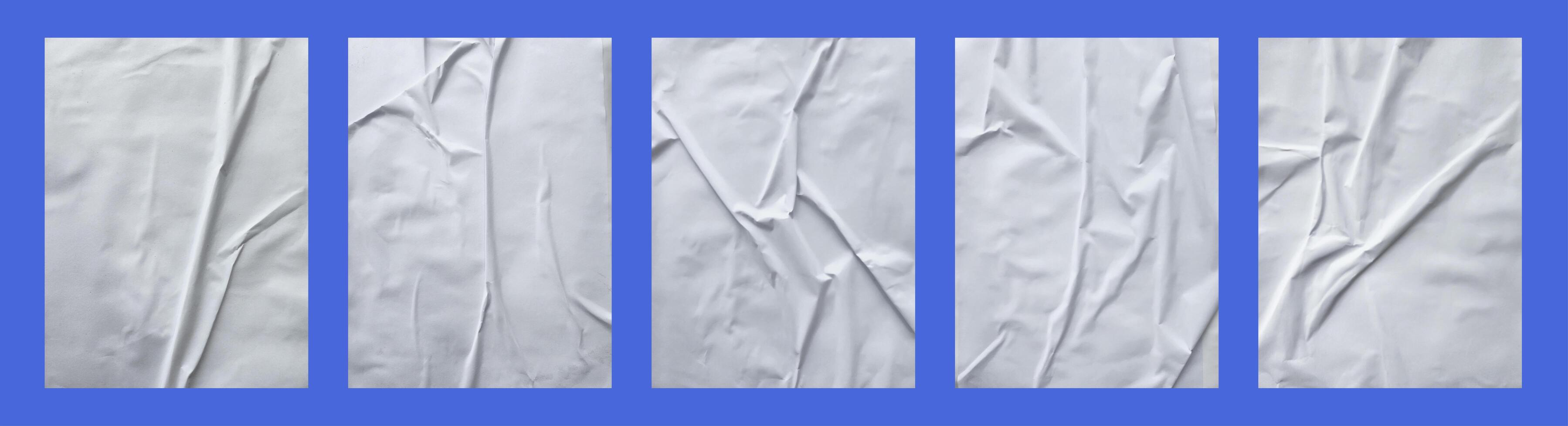 white crumpled and creased glued paper poster set isolated on black background 03 photo