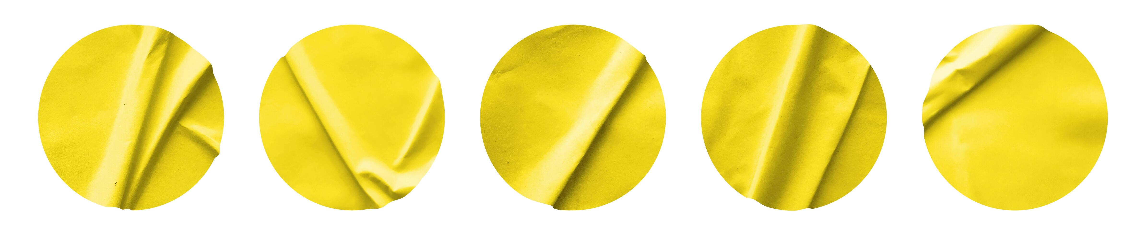 Yellow round paper sticker label isolated on white background photo