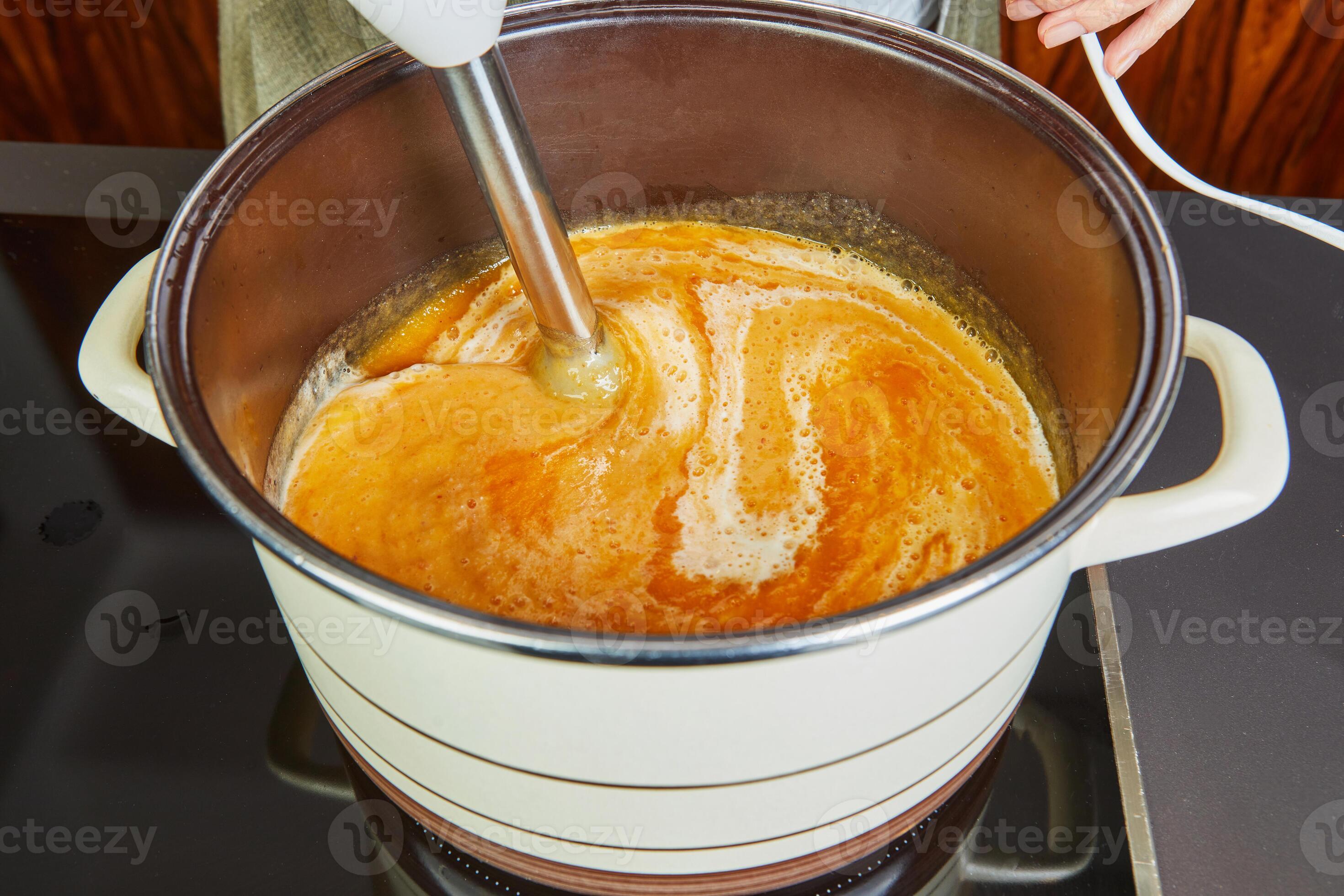 The Housewife Blends Cooked Cream Soup with Immersion Blender on