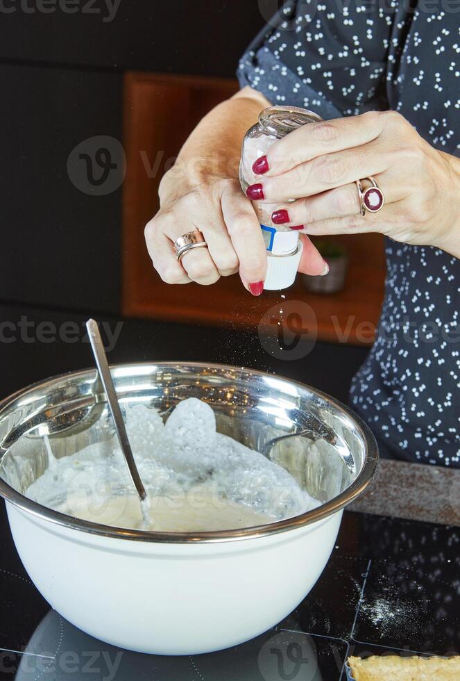 Making a pie in your home kitchen from several types of cheeses, mozzarella, tsfati and others photo