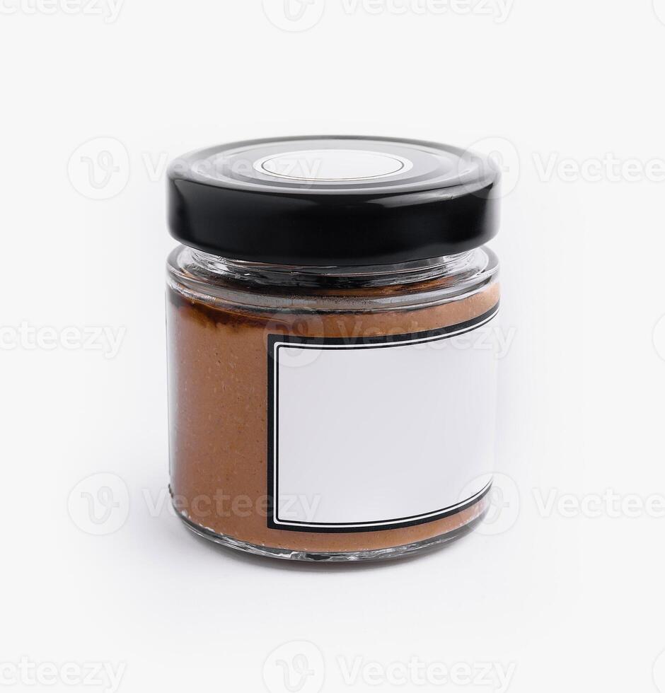 Blank label jar of peanut butter isolated on white photo