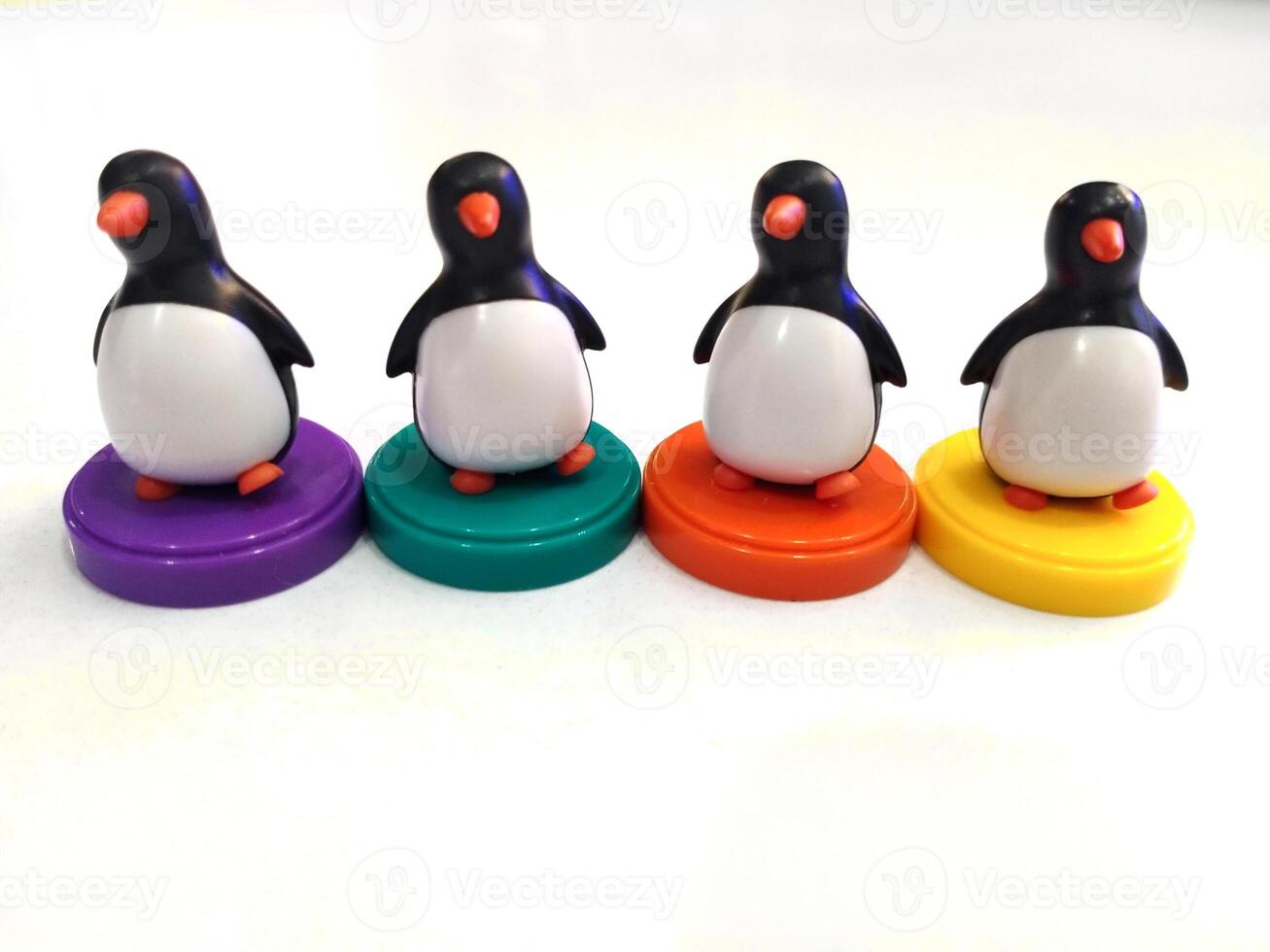 a group of penguin toys isolated on white background. copy space for text. Holiday season themes background photo