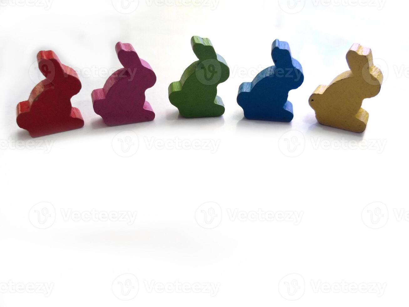colorful rabbits bunny toys isolated in white background. Easter greeting card concept photo