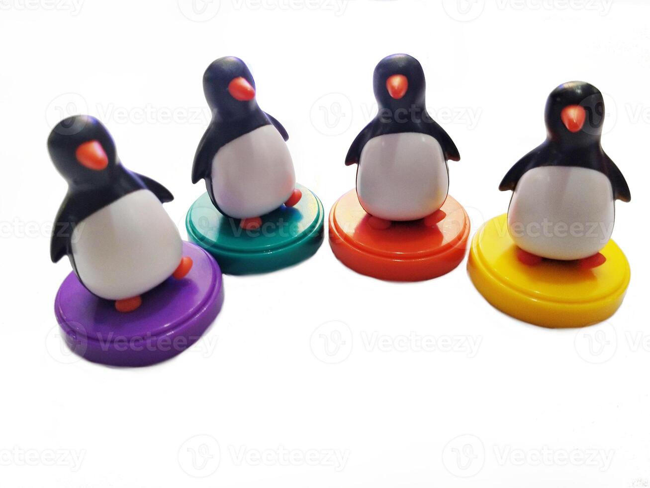a group of penguin toys isolated on white background. copy space for text. Holiday season themes background photo