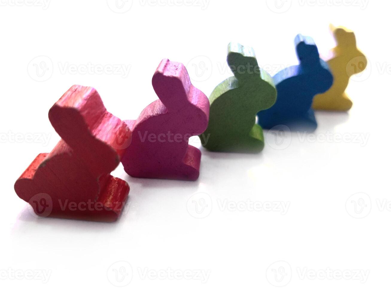 colorful rabbits bunny toys isolated in white background. Easter greeting card concept photo