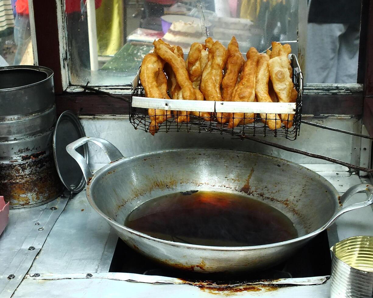 Gorengan is a generic name that refers to a wide group of Indonesian deep fried snacks. Mostly can be found as street food, which is sell it on the cart photo