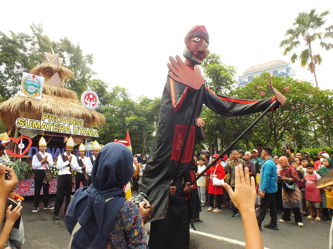 Surakarta City, Central Java, Indonesia, May 15, 2024. Tourist attraction on a traditional costume parade at Slamet Riyadi Street. photo