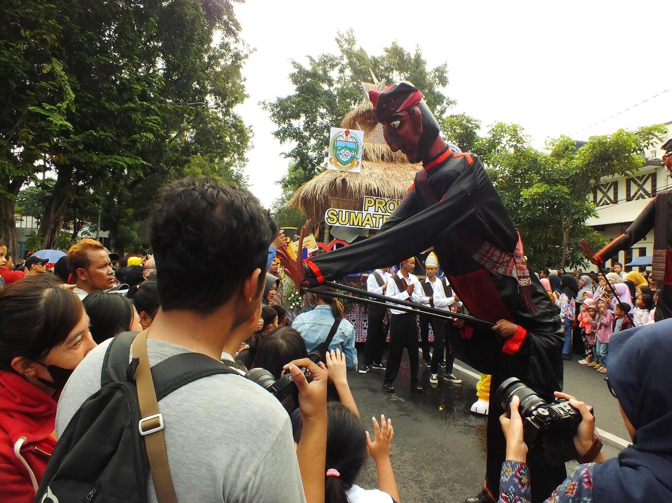 Surakarta City, Central Java, Indonesia, May 15, 2024. Tourist attraction on a traditional costume parade at Slamet Riyadi Street. photo