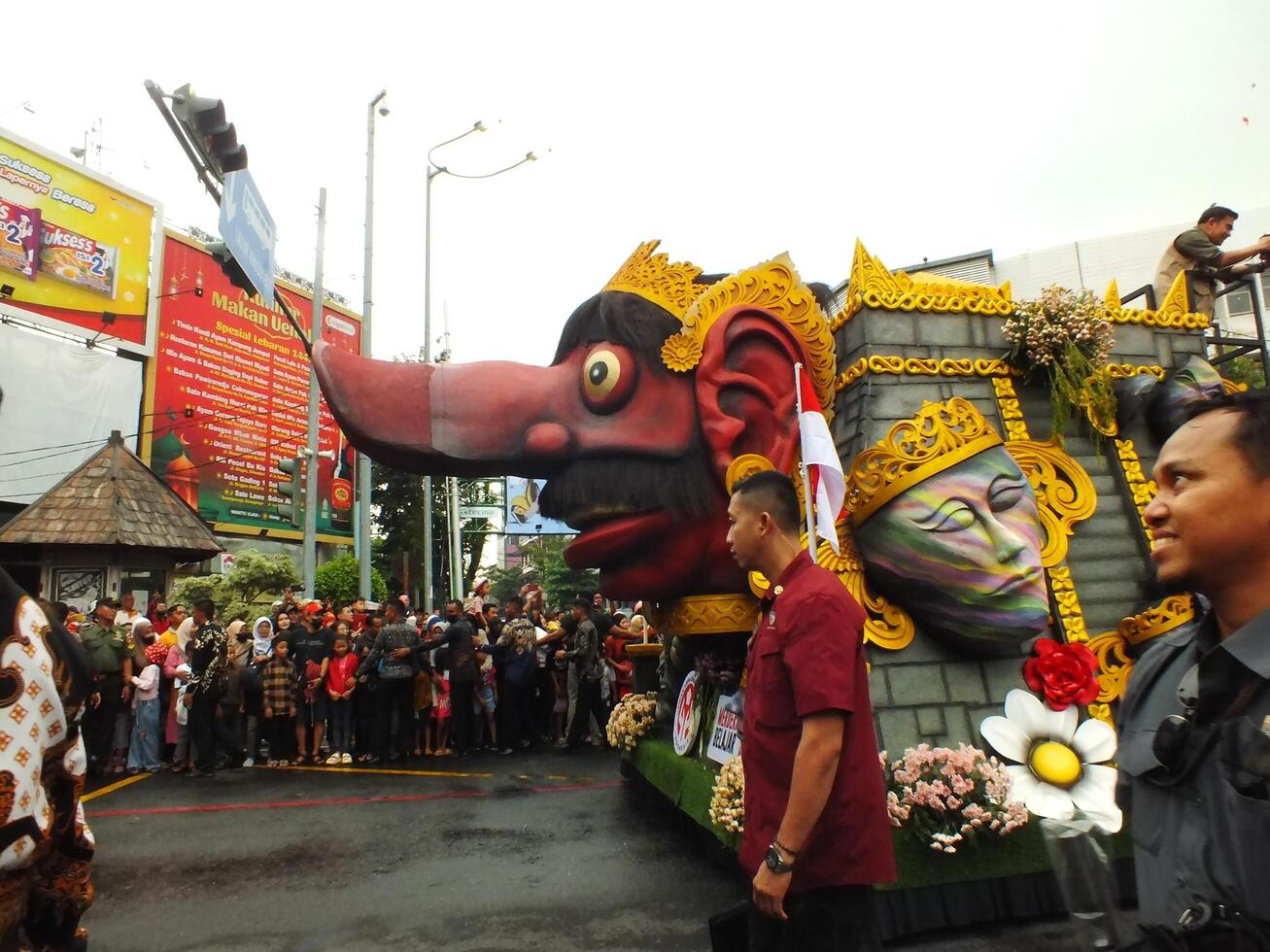 Surakarta City, Central Java, Indonesia, May 15, 2024. Tourist attraction on a traditional costume parade at Slamet Riyadi Street. photo