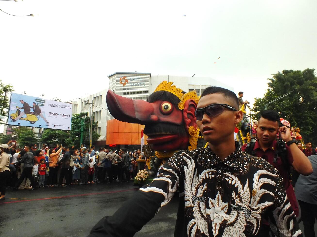 Surakarta City, Central Java, Indonesia, May 15, 2024. Tourist attraction on a traditional costume parade at Slamet Riyadi Street. photo
