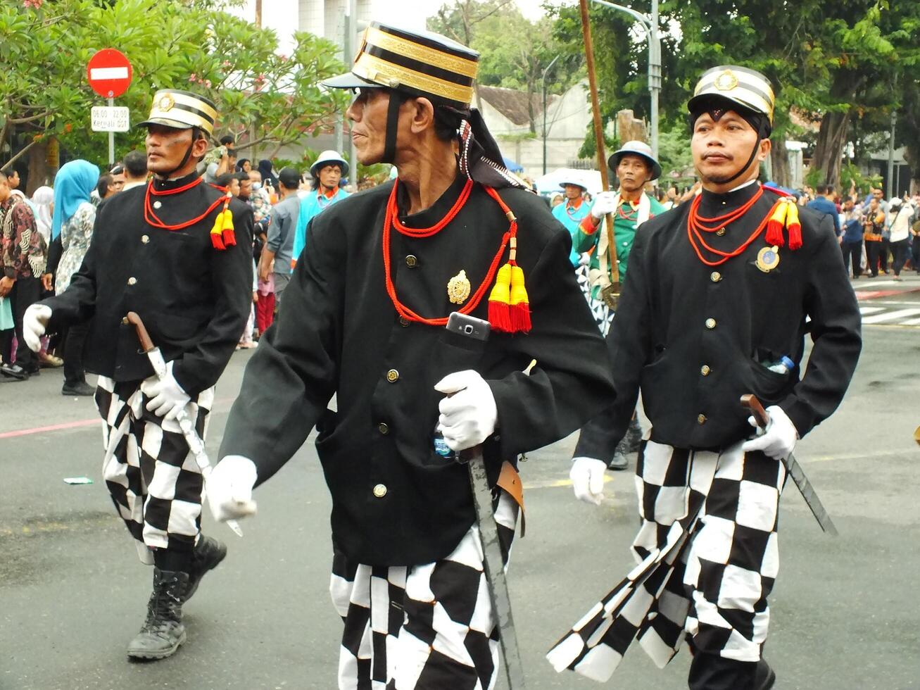 Surakarta City, Central Java, Indonesia, May 15, 2024. Tourist attraction on a traditional costume parade at Slamet Riyadi Street. photo