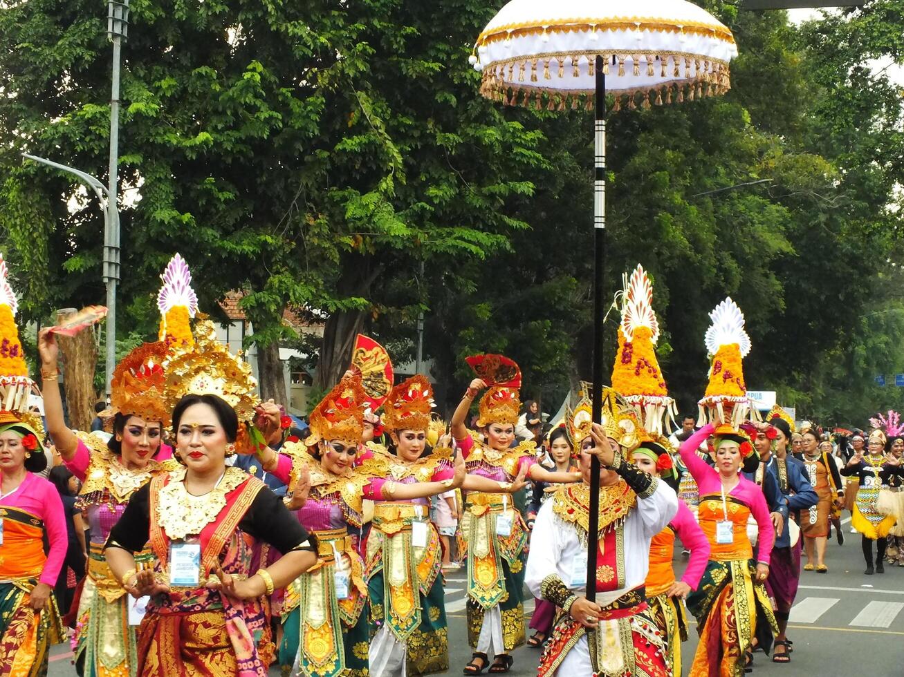 Surakarta City, Central Java, Indonesia, May 15, 2024. Tourist attraction on a traditional costume parade at Slamet Riyadi Street. photo