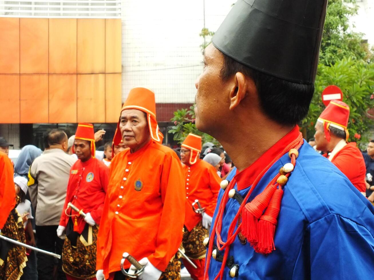 Surakarta City, Central Java, Indonesia, May 15, 2024. Tourist attraction on a traditional costume parade at Slamet Riyadi Street. photo