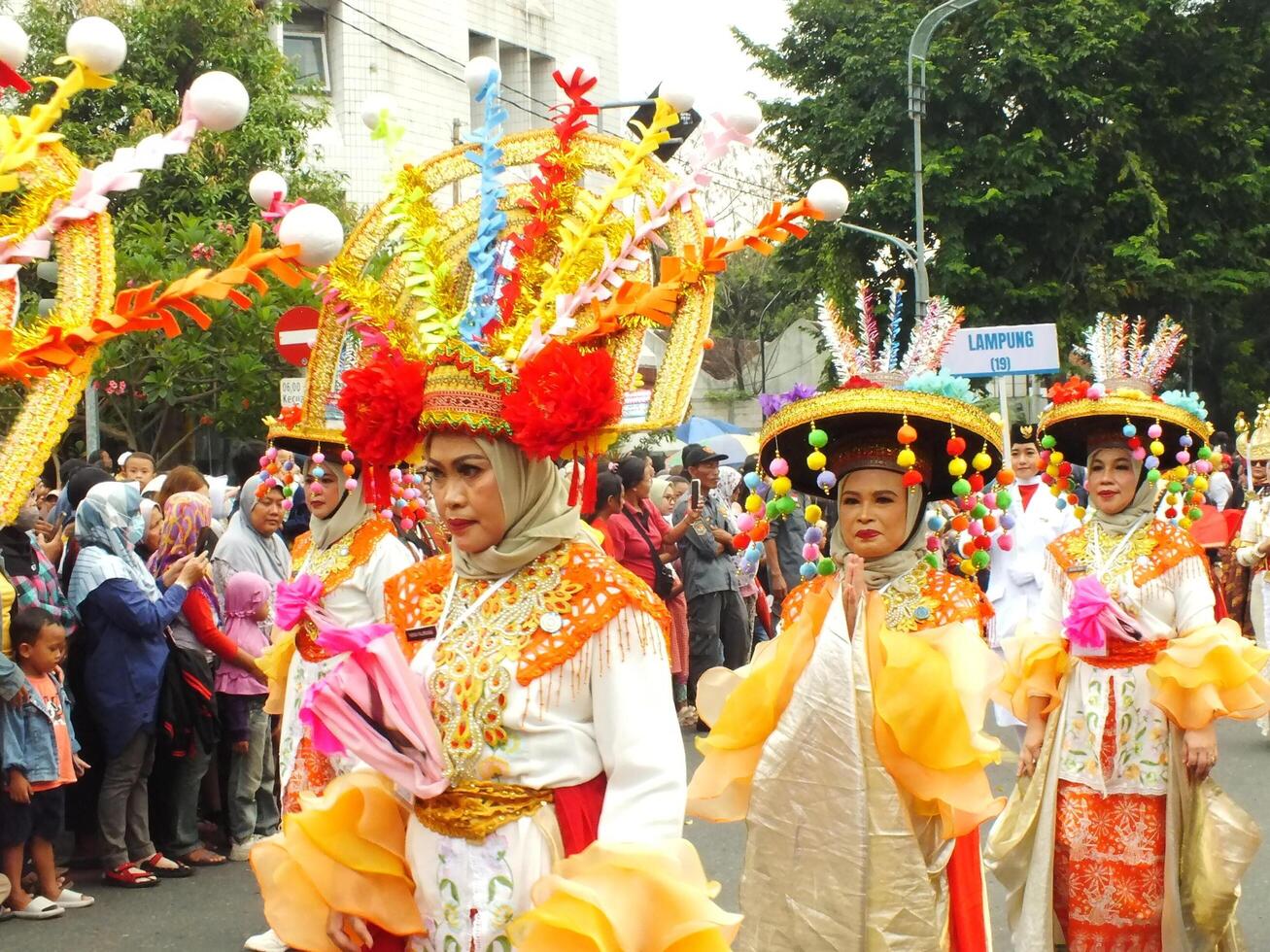 Surakarta City, Central Java, Indonesia, May 15, 2024. Tourist attraction on a traditional costume parade at Slamet Riyadi Street. photo