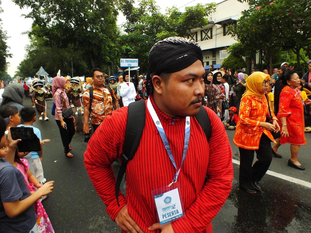 Surakarta City, Central Java, Indonesia, May 15, 2024. Tourist attraction on a traditional costume parade at Slamet Riyadi Street. photo